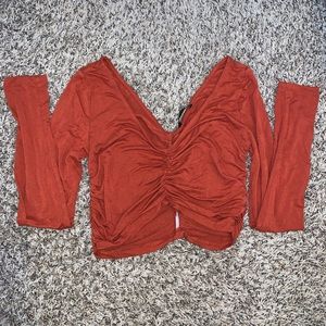 cinched burnt orange crop top